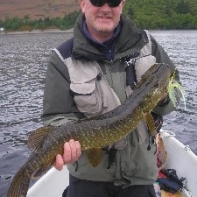 Andrew Hayes and a thirteen pounder on a fly